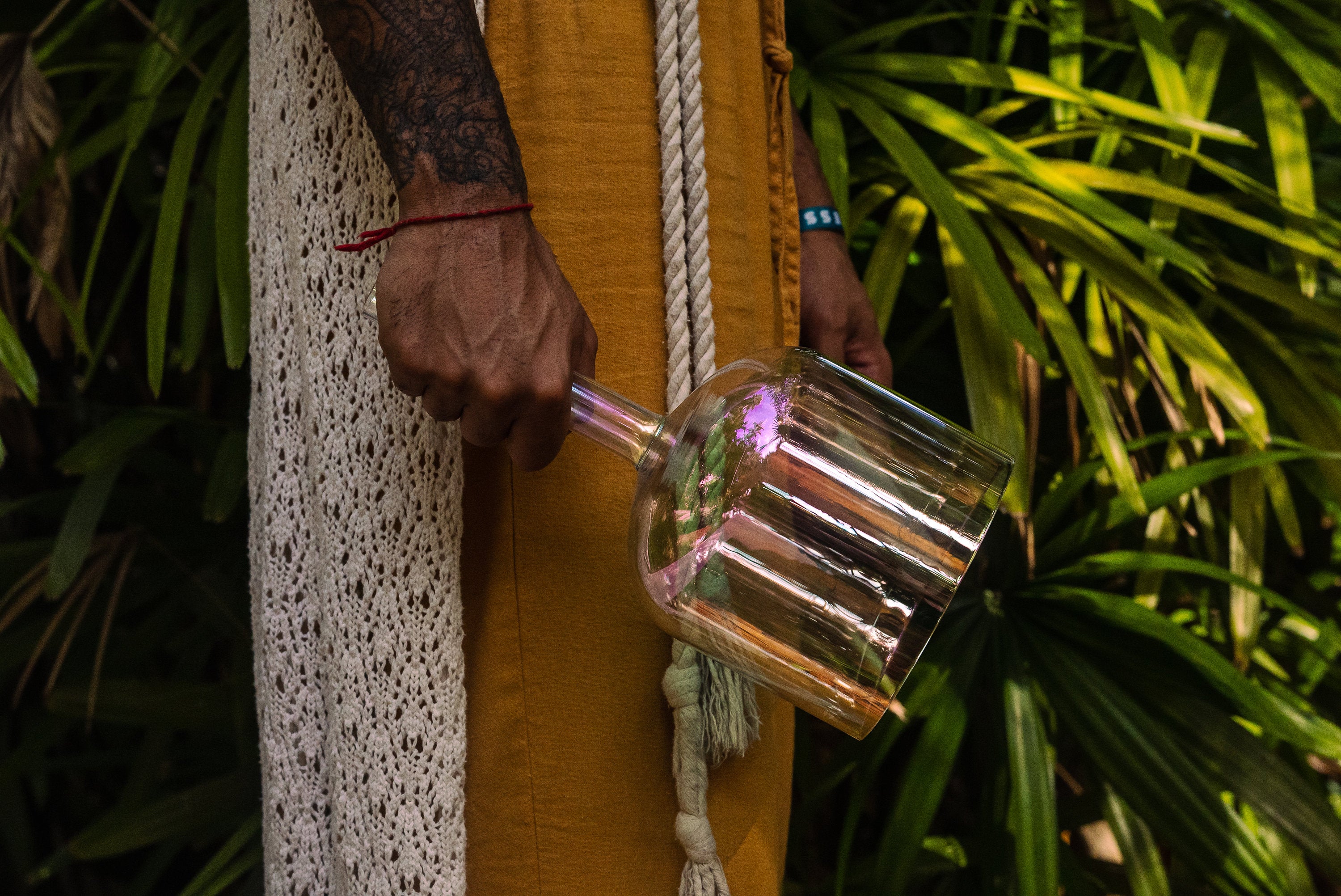 Mans hand holding a Handheld Practitioner Bowl